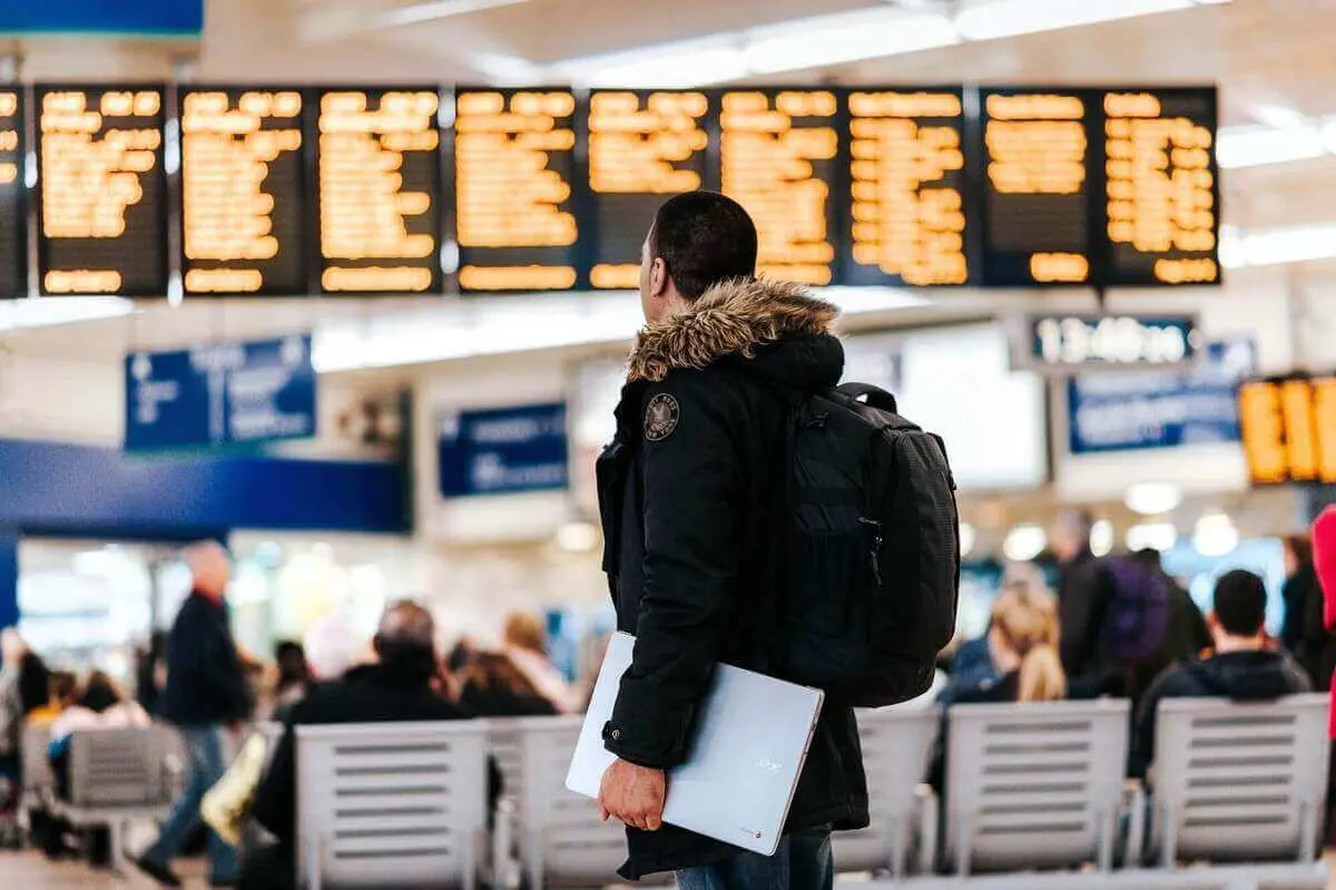 Travelers arriving at an airport terminal