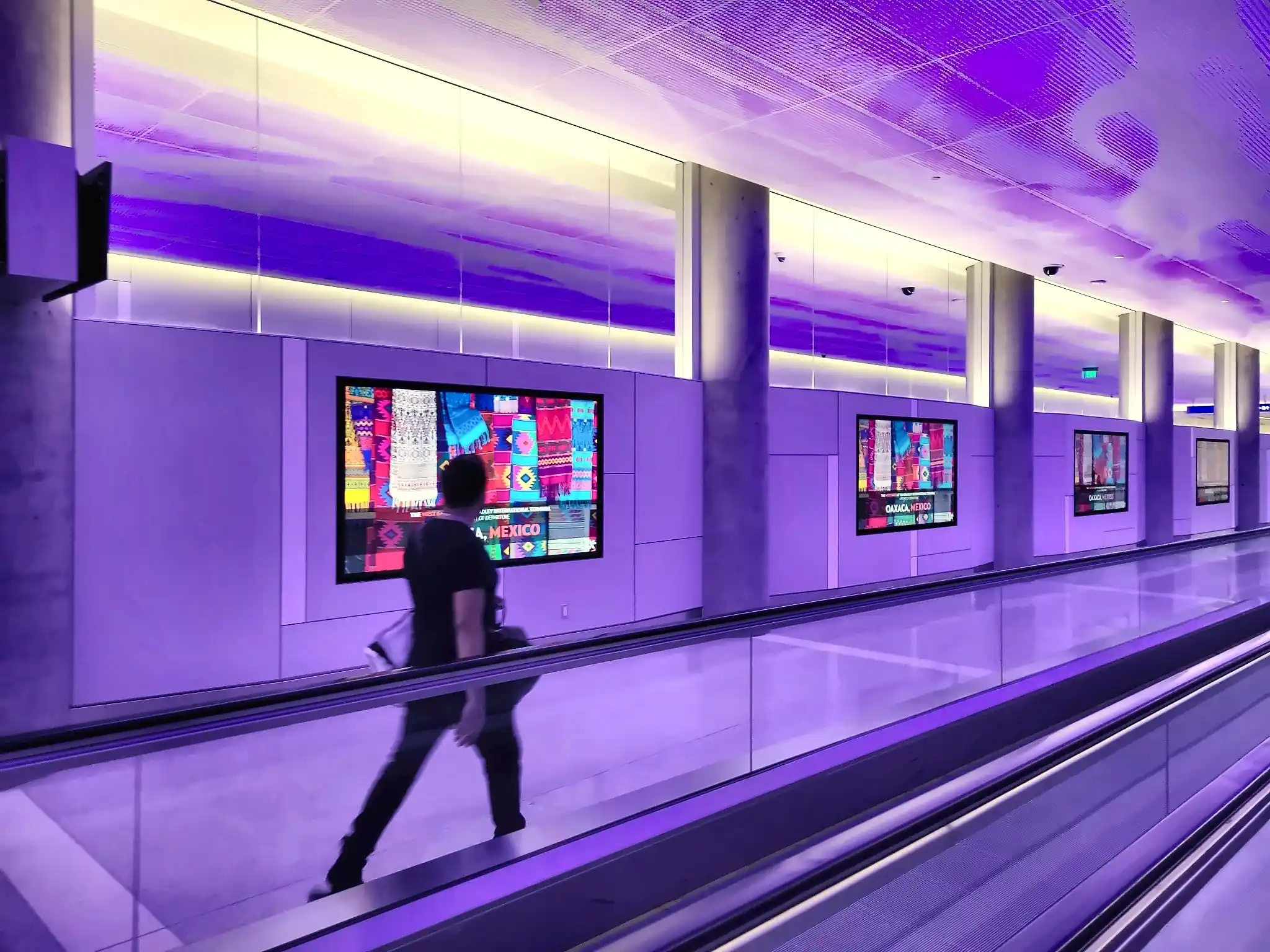 Oaxaca Mexico digital screen network on a moving walkway