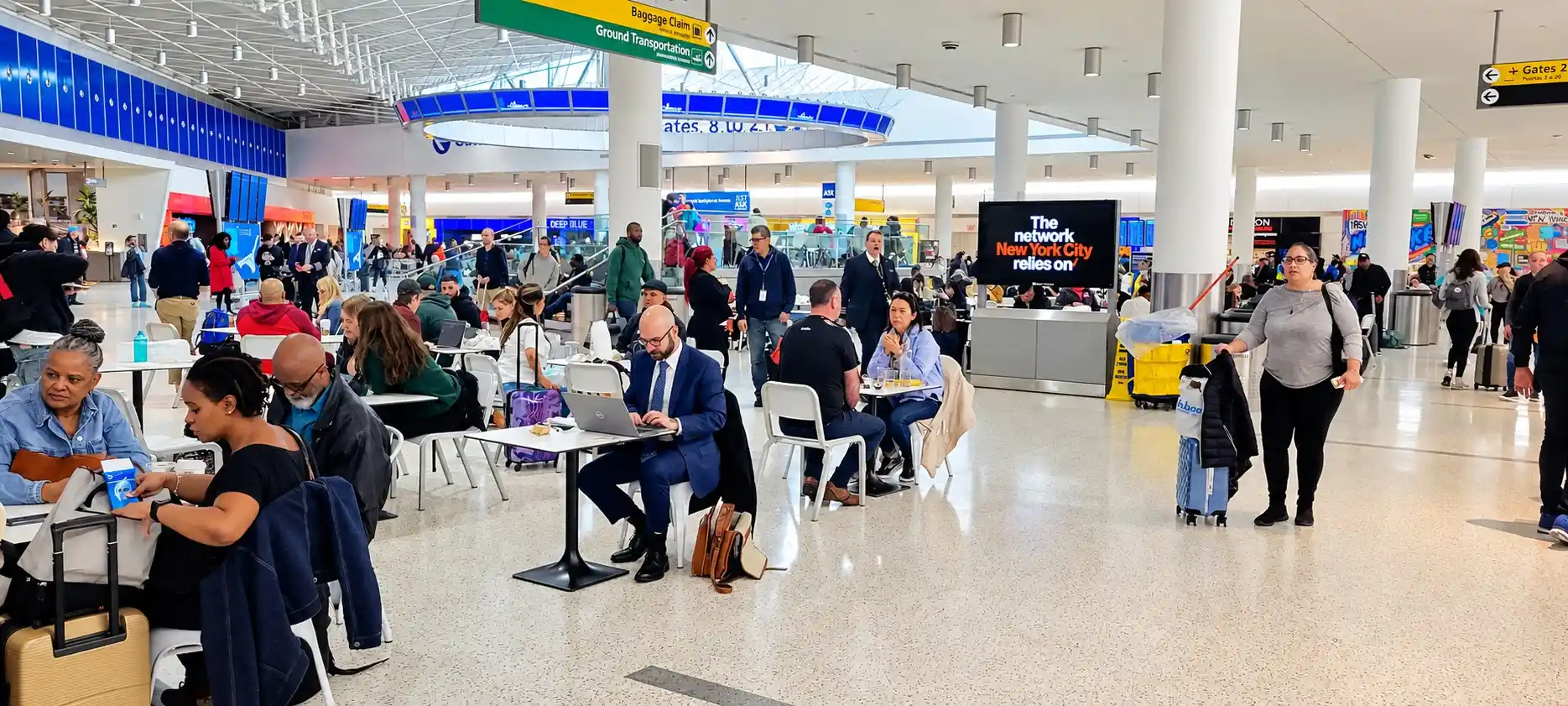 Digital screen network in a terminal seating area